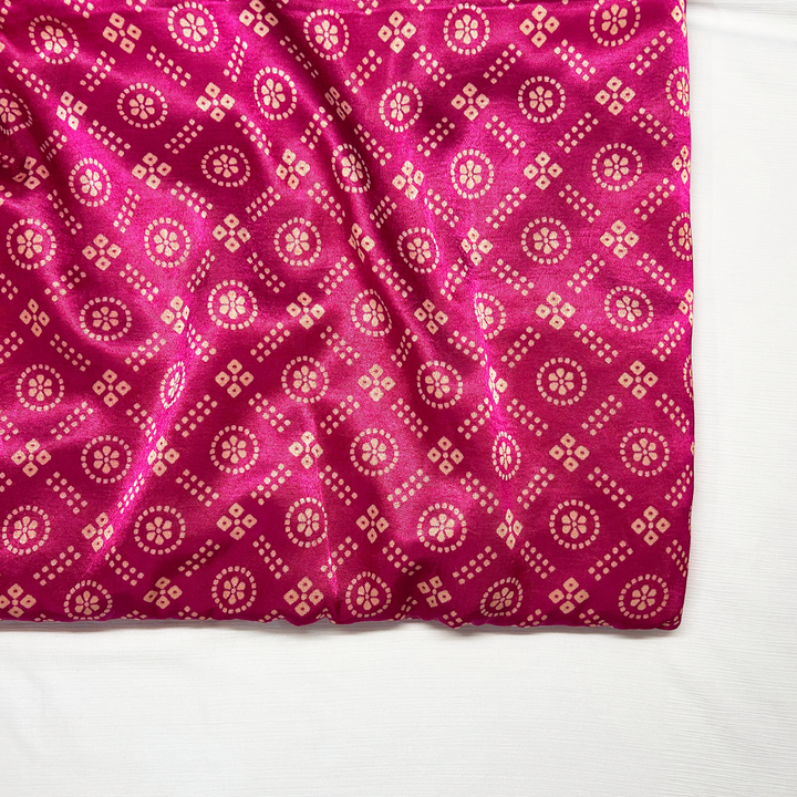 Hot pink Mashru silk fabric with golden Patola print detail