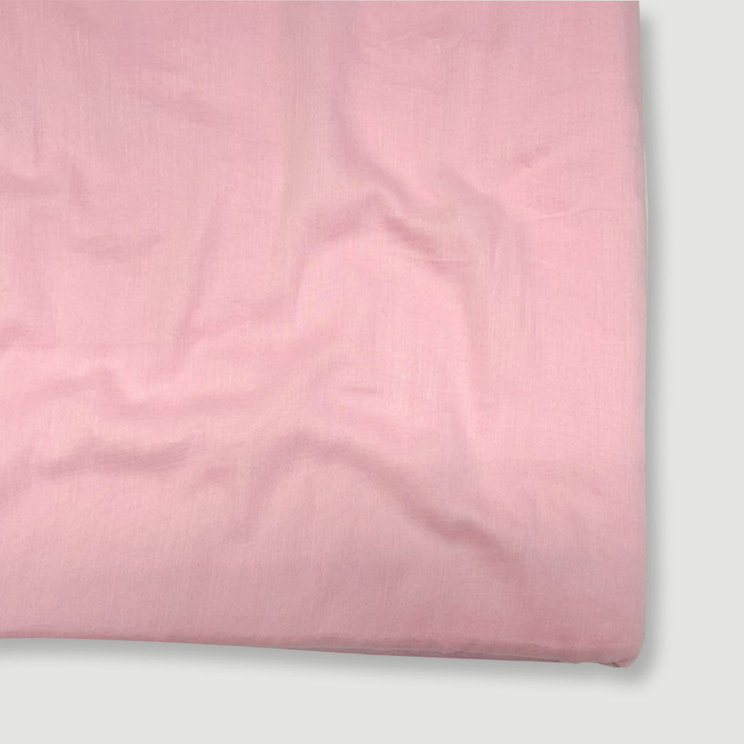 Soft light pink Mul Mul plain cotton fabric texture.