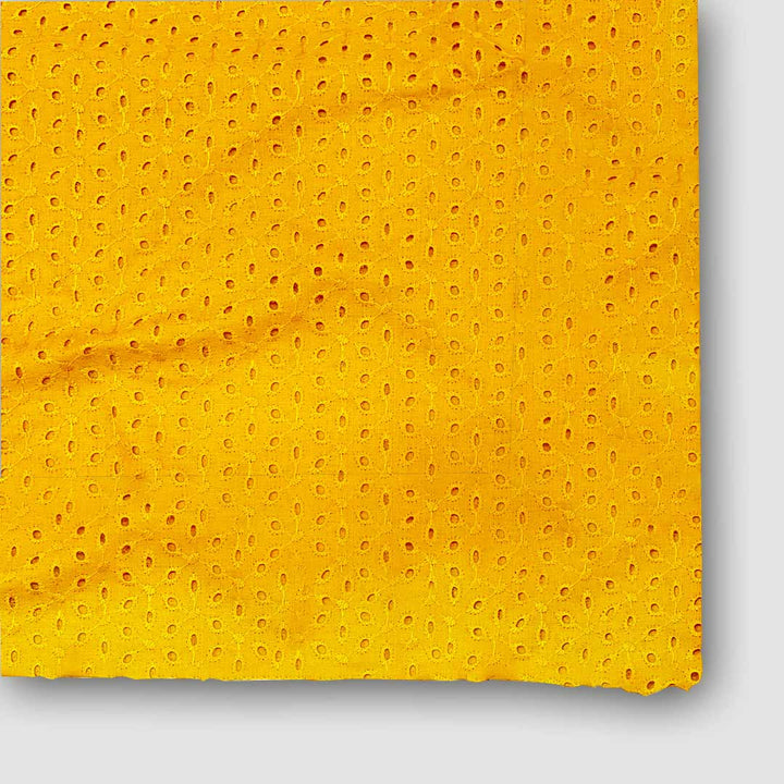 Bright yellow Hakoba cotton fabric with intricate eyelet embroidery