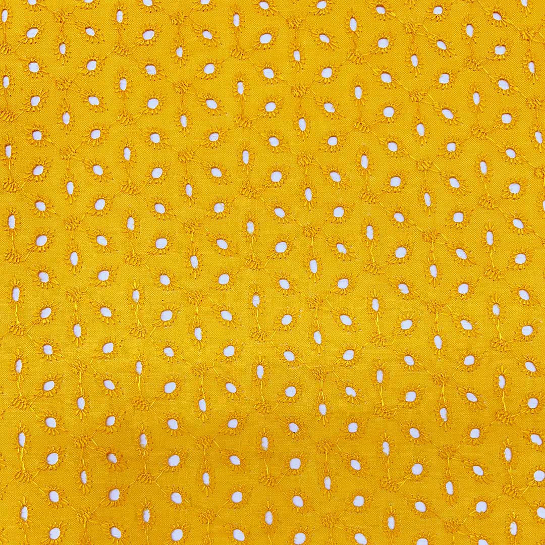 Bright yellow Hakoba cotton fabric with intricate eyelet embroidery