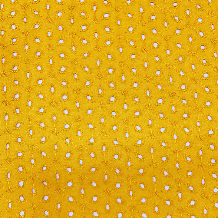 Bright yellow Hakoba cotton fabric with intricate eyelet embroidery