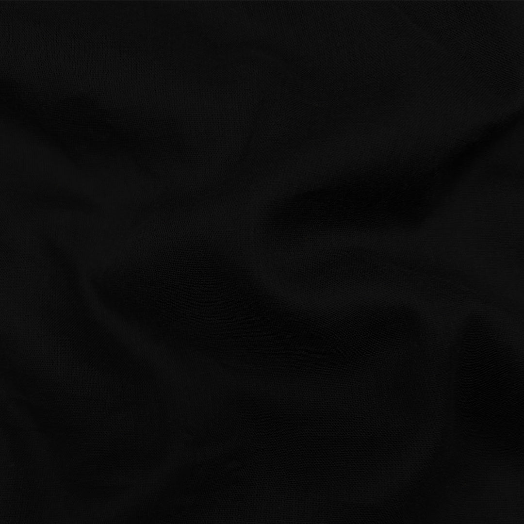 Soft black Mul-Mul plain cotton fabric close up