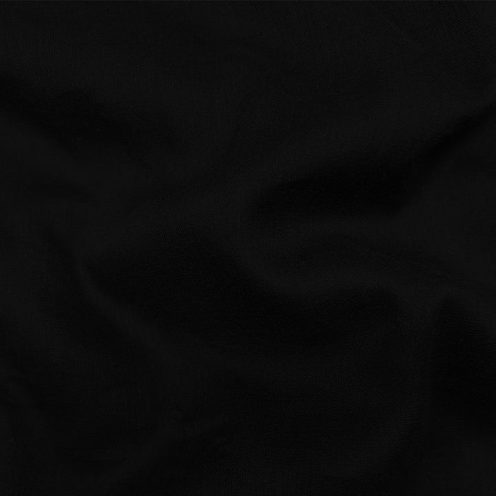 Soft black Mul-Mul plain cotton fabric close up