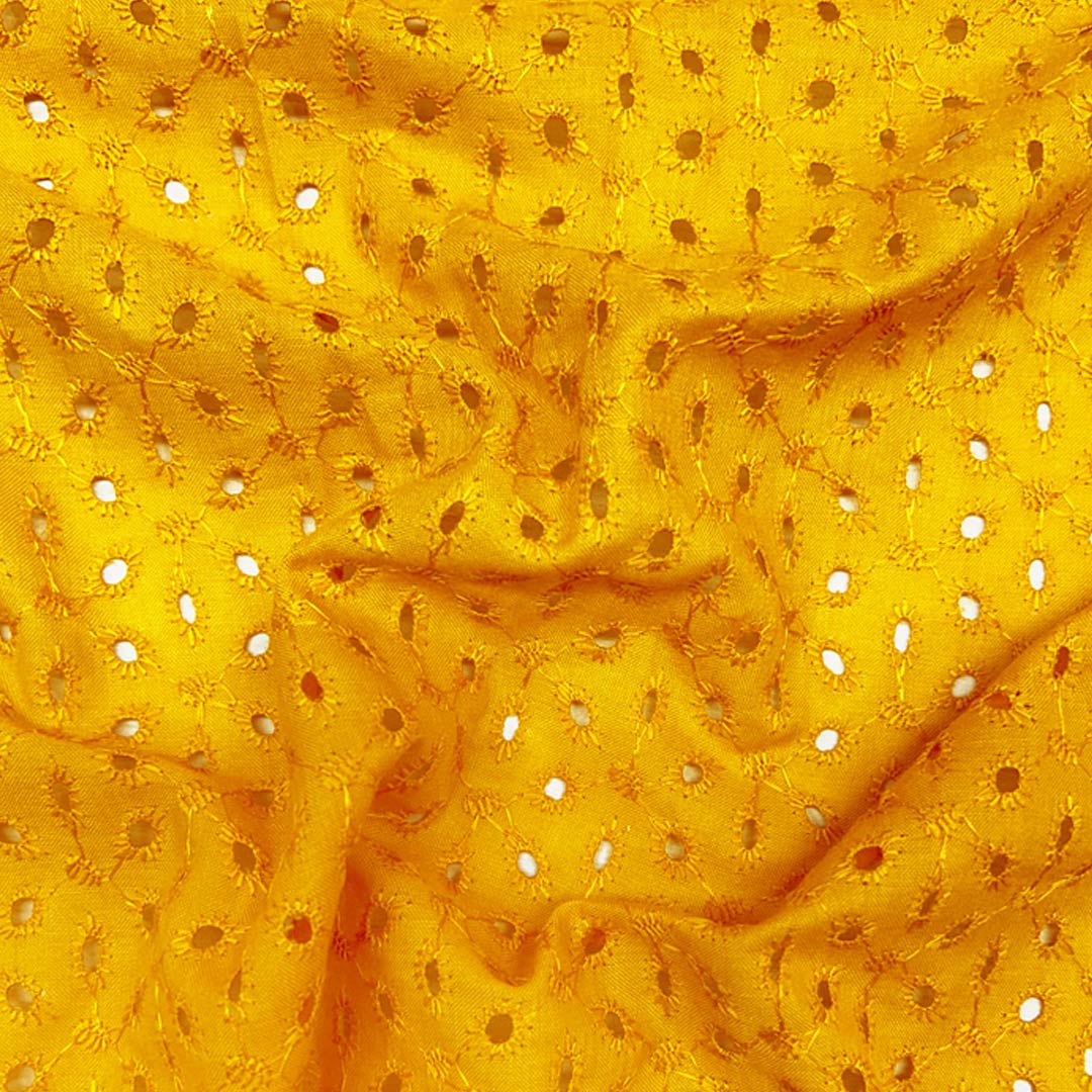 Bright yellow Hakoba cotton fabric with intricate eyelet embroidery