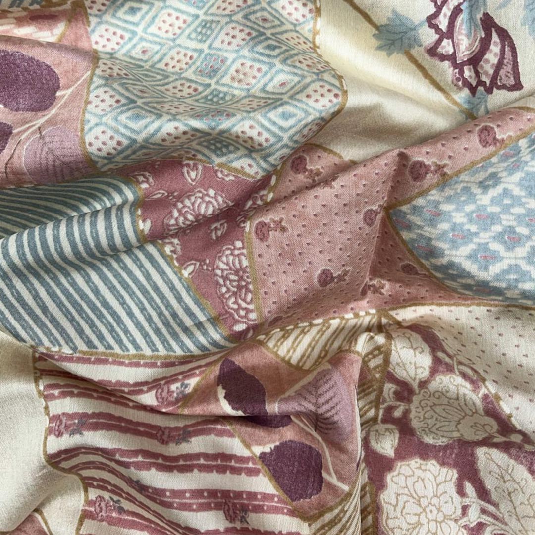 Intricate patchwork design with florals and geometric patterns in light pink on Chanderi foil print fabric from Fabrics @StudioLCX.