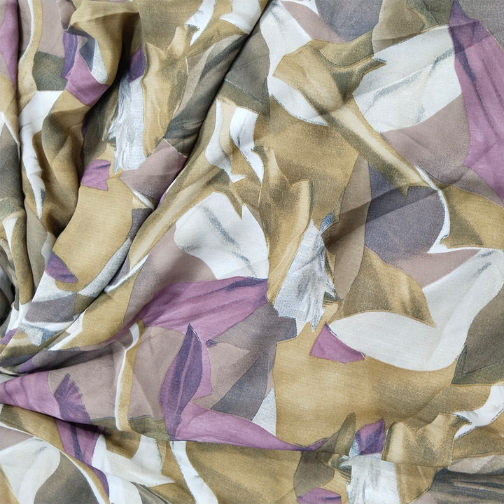  Artistic abstract print in copper tones on luxurious georgette fabric close up