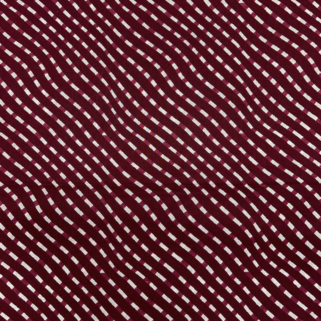 Classic maroon with white stripe pattern on soft cotton fabric, ideal for creating stylish and comfortable clothing.