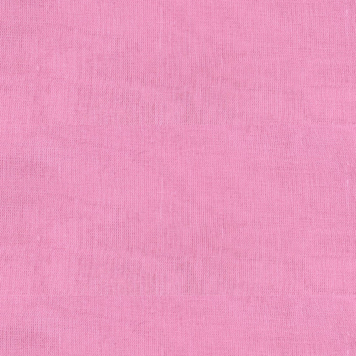 Bright neon pink Mul Mul cotton fabric, smooth and airy, perfect for comfortable and stylish garments at Fabrics @StudioLCX.