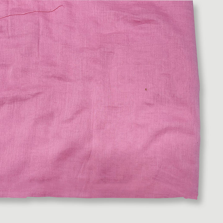 Bright neon pink Mul Mul cotton fabric, smooth and airy, perfect for comfortable and stylish garments at Fabrics @StudioLCX.