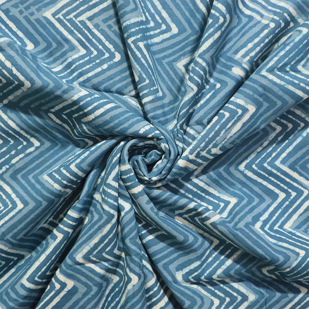 Contemporary greyish blue Dabu cotton fabric with a versatile chevron pattern