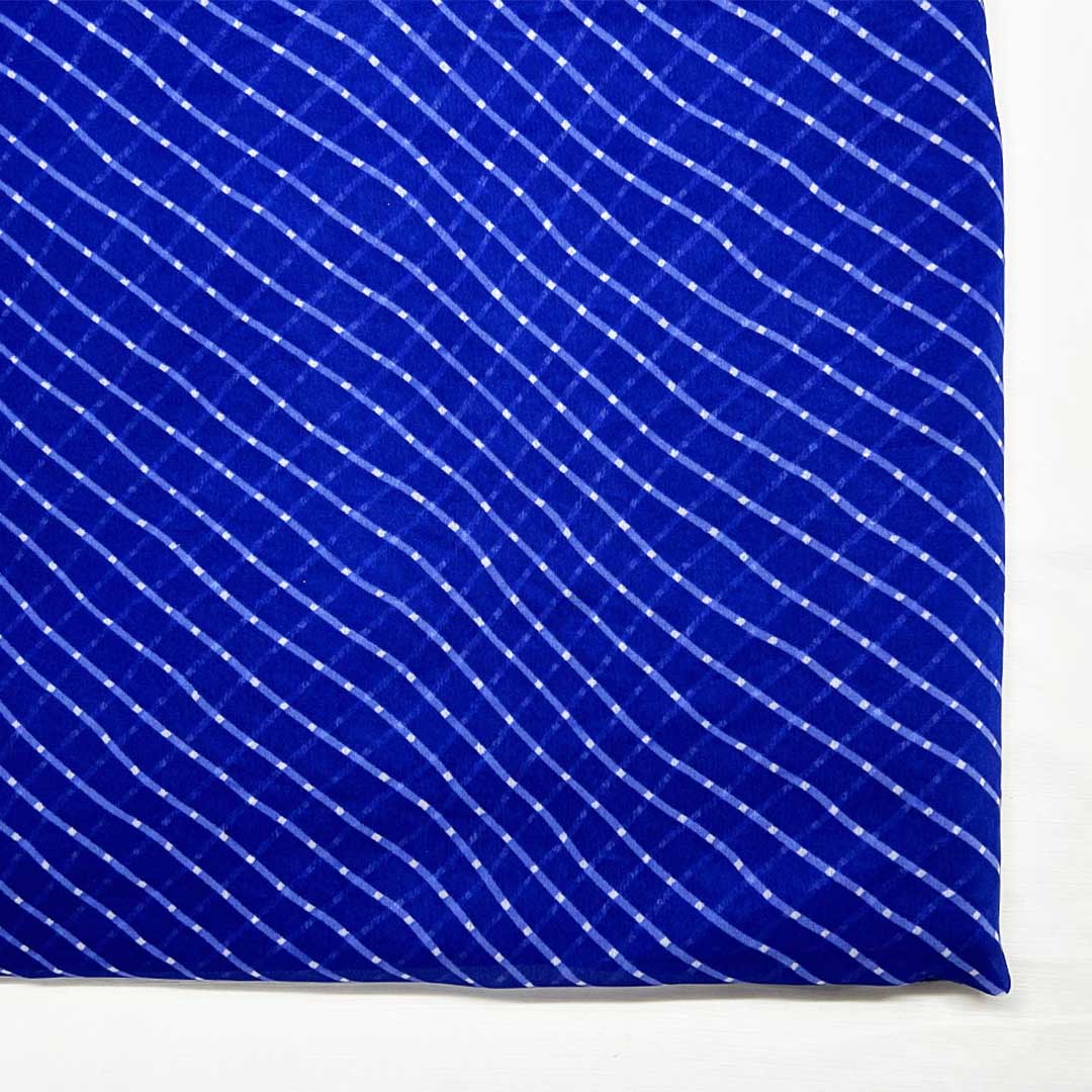 royal blue georgette fabric with white stripes and a wavy pattern