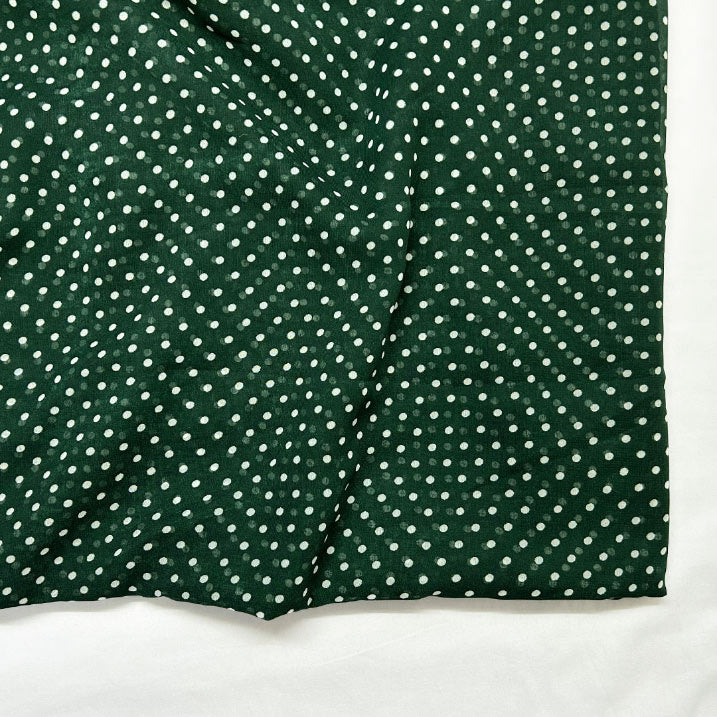 Light georgette fabric in green with playful white dot print