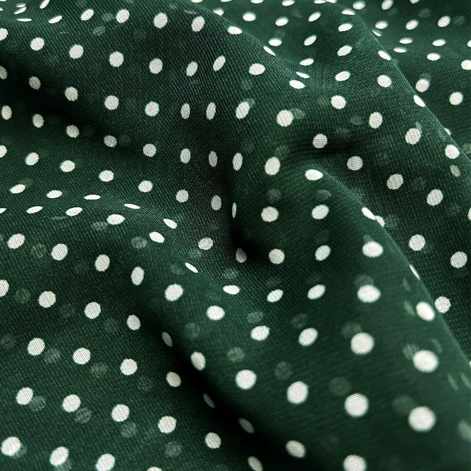 Light georgette fabric in green with playful white dot print