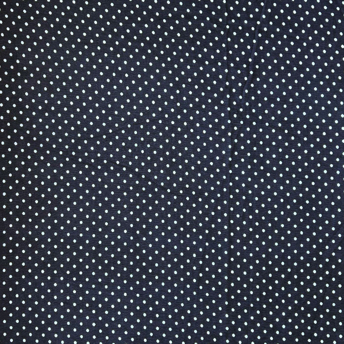 Stylish navy blue georgette fabric with playful white polka dots available at Fabrics @StudioLCX for fashionable attire.