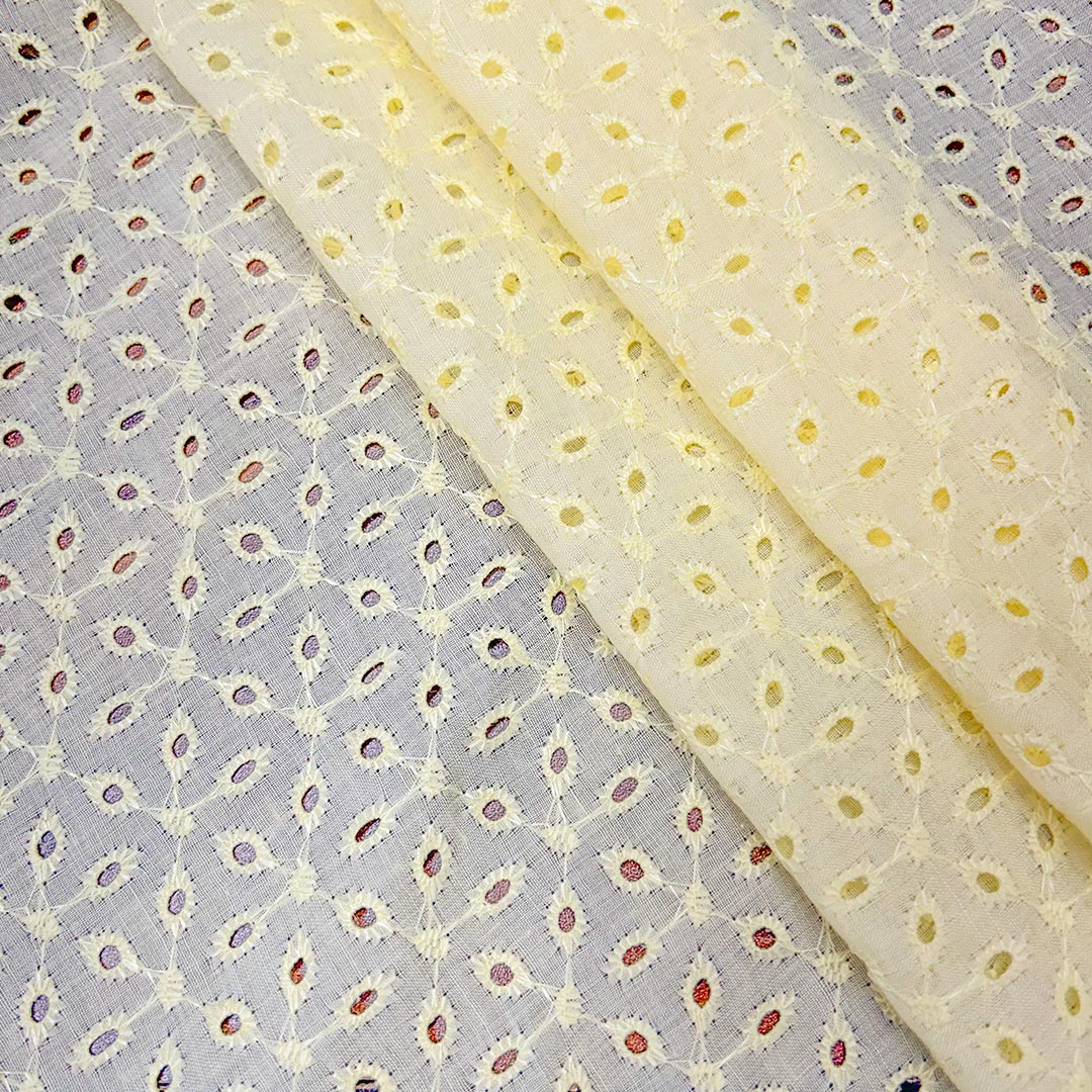 Soft light yellow cotton hakoba fabric with intricate embroidery, offering a fresh and cheerful appeal for exclusive garment creation.