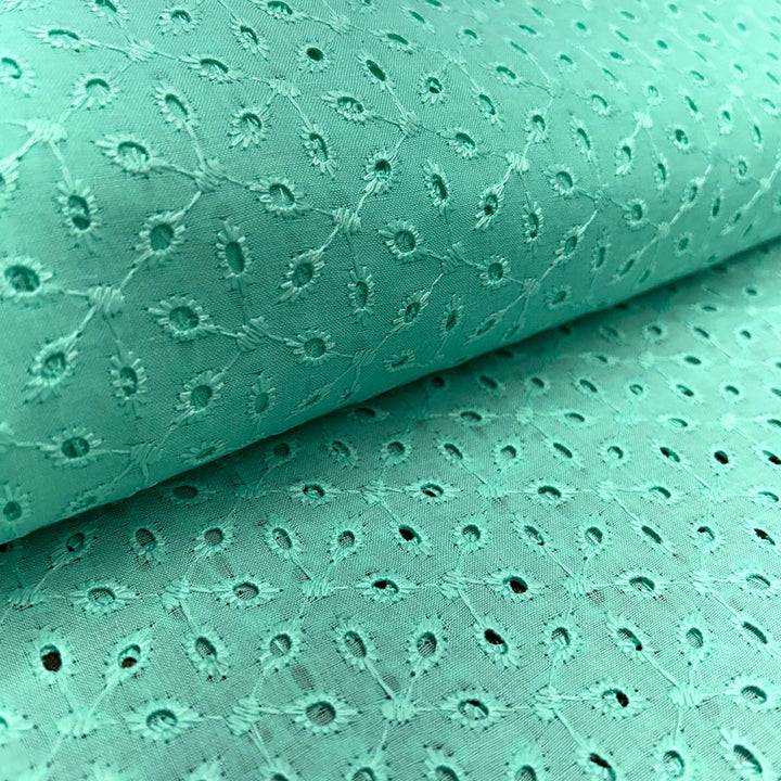 Light sea green cotton hakoba fabric with delicate embroidery, ideal for sophisticated and timeless fashion designs.