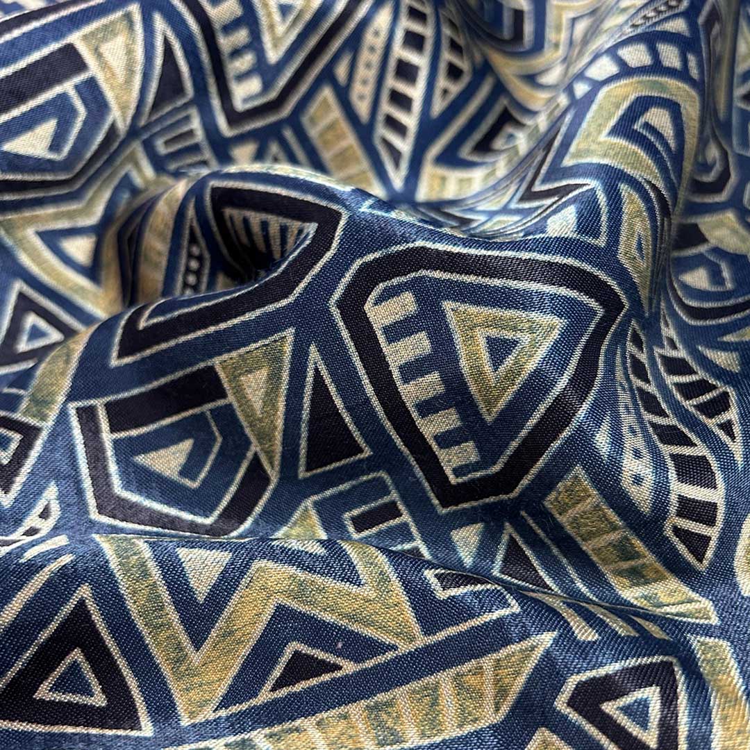 Navy blue Ajrakh Mashru silk fabric featuring geometric Patola patterns, combining tradition and elegance for sophisticated attire.