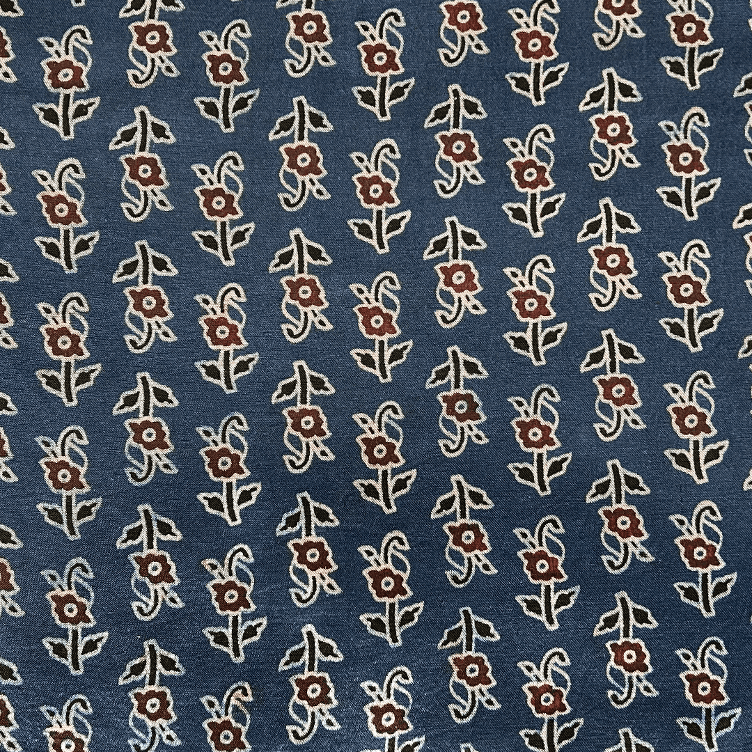 Ocean blue Mashru silk adorned with delicate floral Ajrakh patterns, ideal for refined and elegant apparel at Fabrics @StudioLCX.