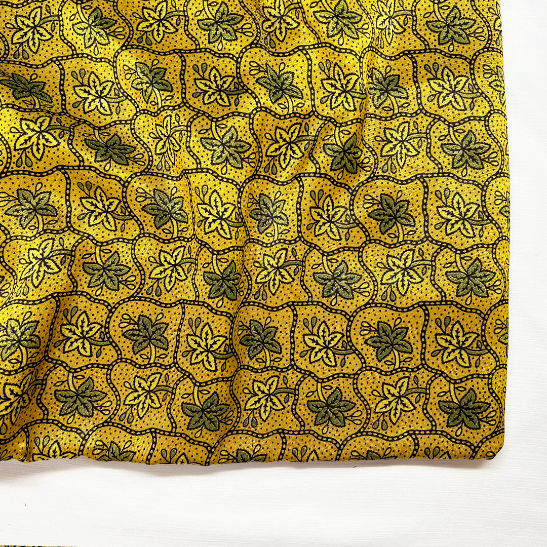 Traditional Ajrakh pattern in golden and black on luxurious Mashru silk fabric