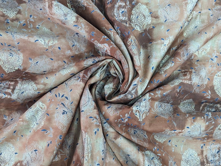 Earthy toned muslin fabric with intricate abstract print and subtle blue accents