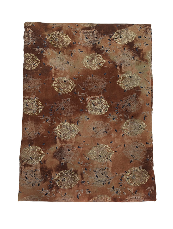 Earthy toned muslin fabric with intricate abstract print and subtle blue accents