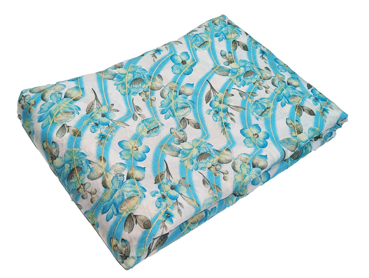 Elegant blue muslin fabric with white floral print for stylish creations