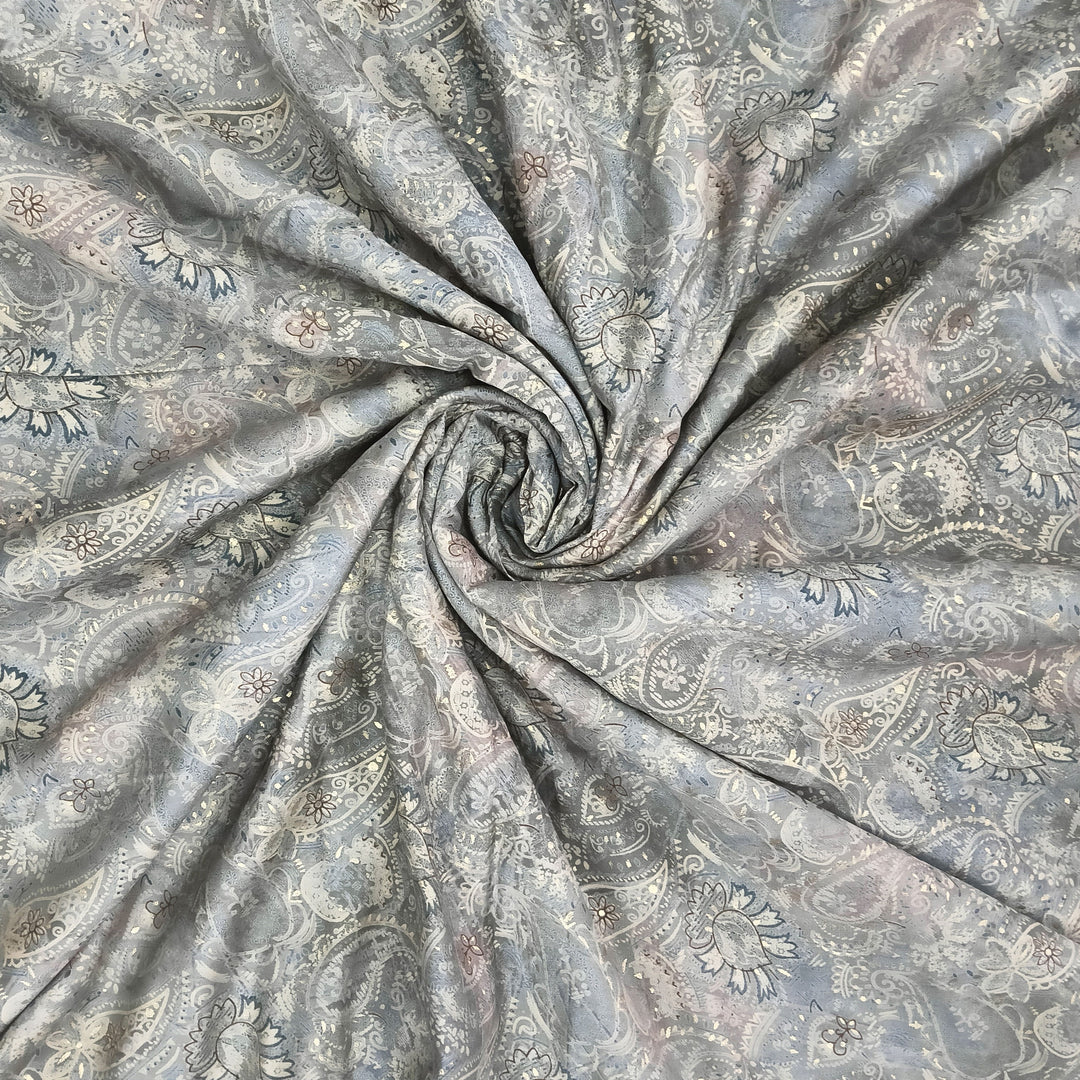 Soft muslin fabric with classic grey paisley print, perfect for elegant apparel