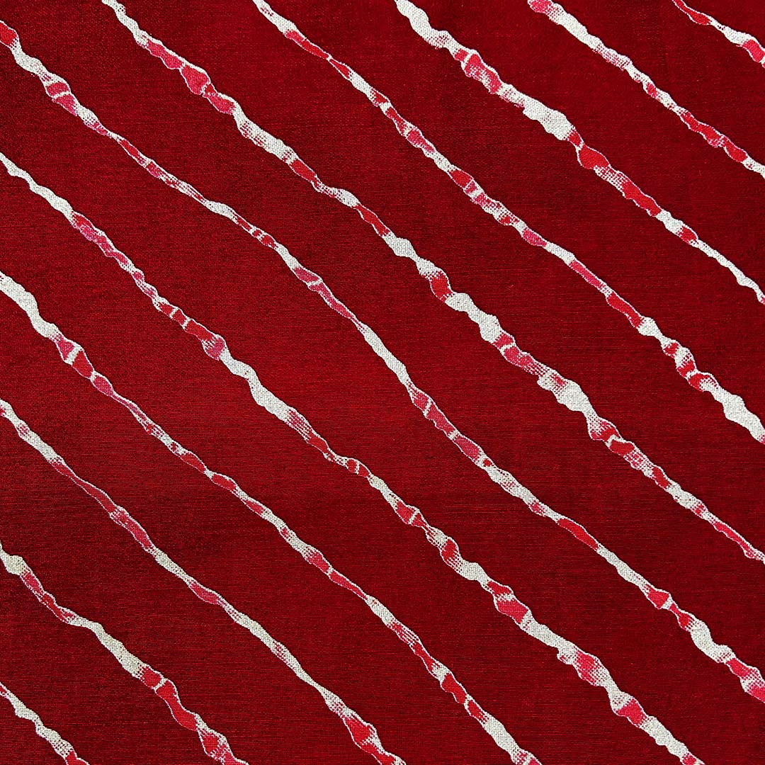 Traditional maroon shade leheriya printed on muslin fabric, ideal for crafting unique and breathable fashion pieces.