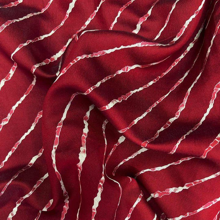 Traditional maroon shade leheriya printed on muslin fabric, ideal for crafting unique and breathable fashion pieces.