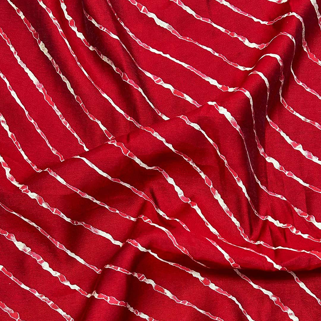 Elegant maroon shade leheriya printed muslin fabric, capturing traditional dyeing techniques in a lightweight, breathable material for contemporary designs.