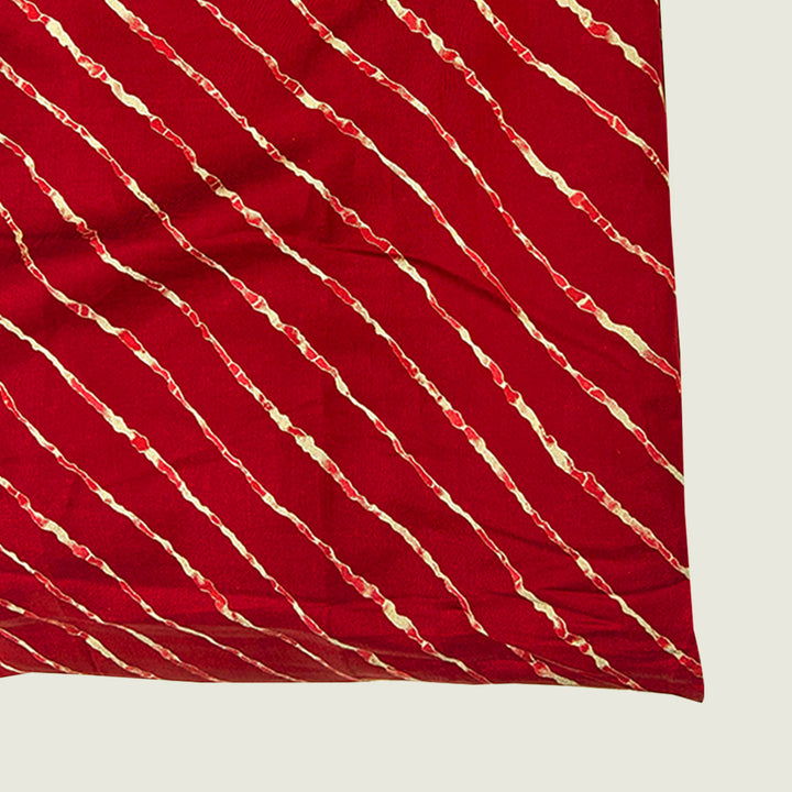 Elegant maroon shade leheriya printed muslin fabric, capturing traditional dyeing techniques in a lightweight, breathable material for contemporary designs.