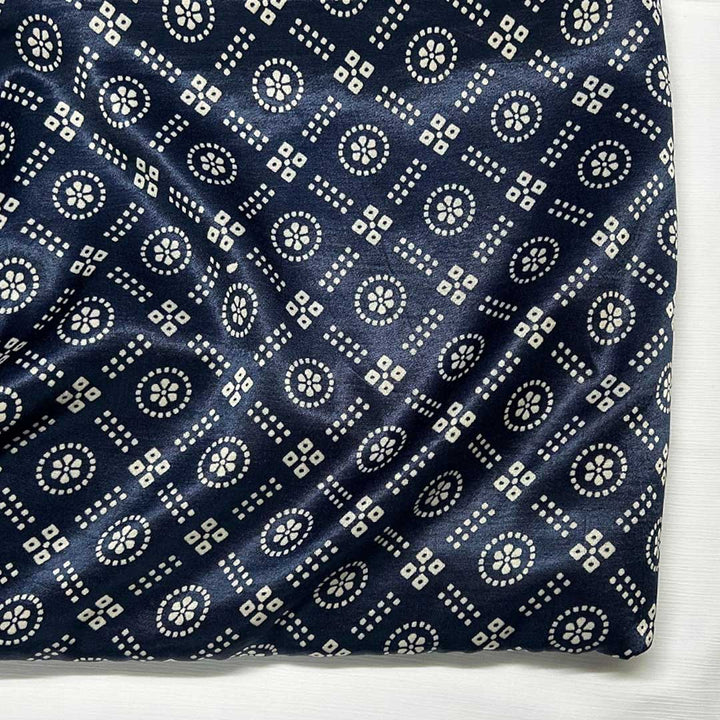 Close-up of traditional navy blue and white geometric Patola printed Mashru silk fabric from Fabrics @StudioLCX.