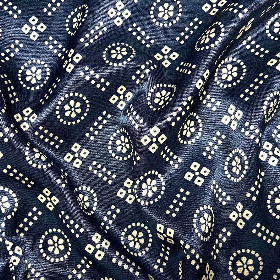 Close-up of traditional navy blue and white geometric Patola printed Mashru silk fabric from Fabrics @StudioLCX.