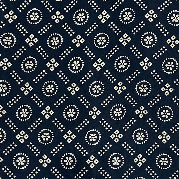 Close-up of traditional navy blue and white geometric Patola printed Mashru silk fabric from Fabrics @StudioLCX.