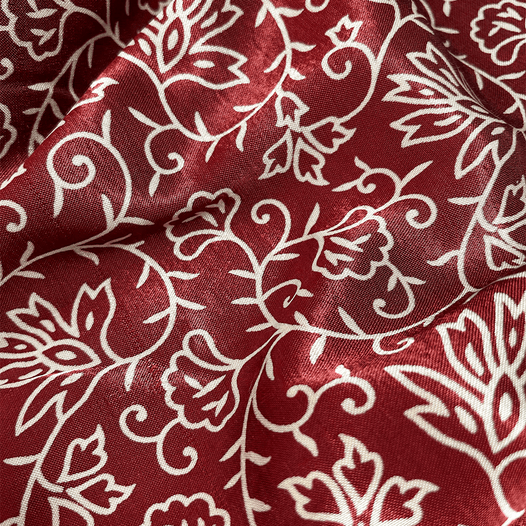 Luxurious maroon floral patola printed ajrakh mashru silk fabric, perfect for exclusive and traditional attire.