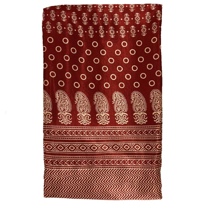 Rich maroon Mashru silk featuring a detailed Patola print, blending traditional motifs with luxurious fabric for distinguished wear.