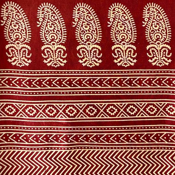 Rich maroon Mashru silk featuring a detailed Patola print, blending traditional motifs with luxurious fabric for distinguished wear.