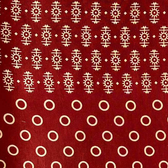 Rich maroon Mashru silk featuring a detailed Patola print, blending traditional motifs with luxurious fabric for distinguished wear.