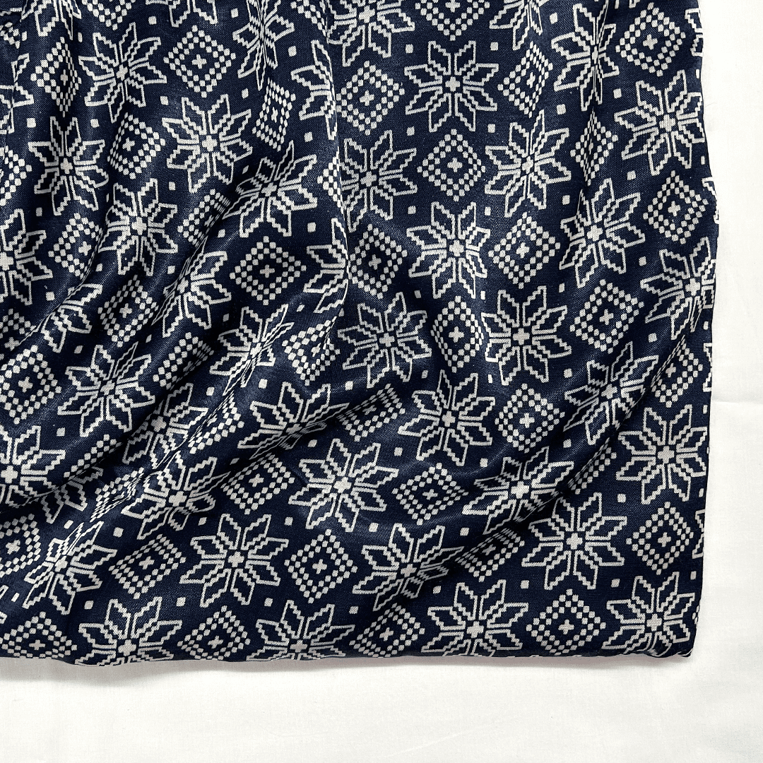 Elegant navy blue silk fabric with white star-shaped Patola patterns, ideal for luxurious garments at Fabrics @StudioLCX.