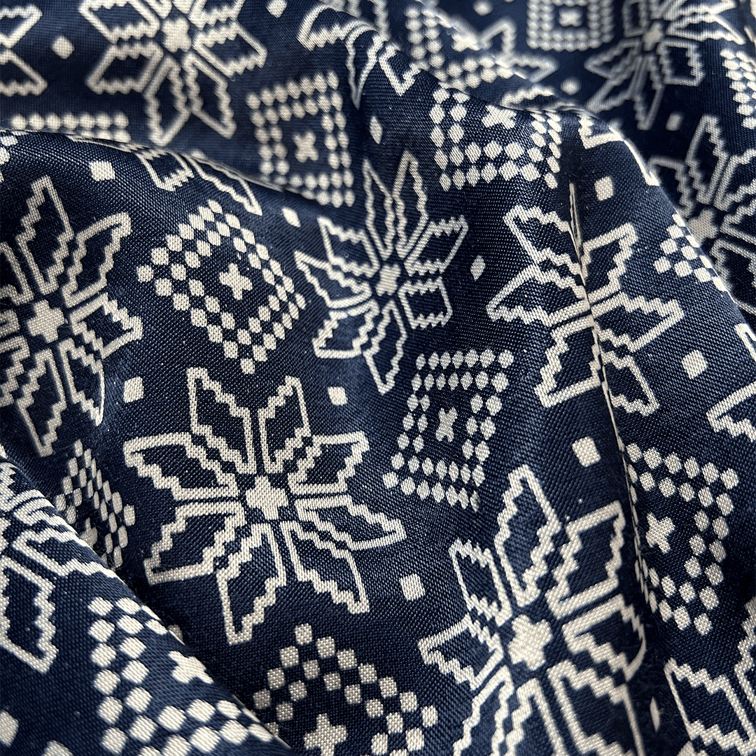 Elegant navy blue silk fabric with white star-shaped Patola patterns, ideal for luxurious garments at Fabrics @StudioLCX.