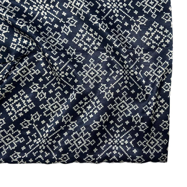 Elegant navy blue Patola printed Mashru silk fabric with intricate designs for luxurious sewing projects at StudioLCX.