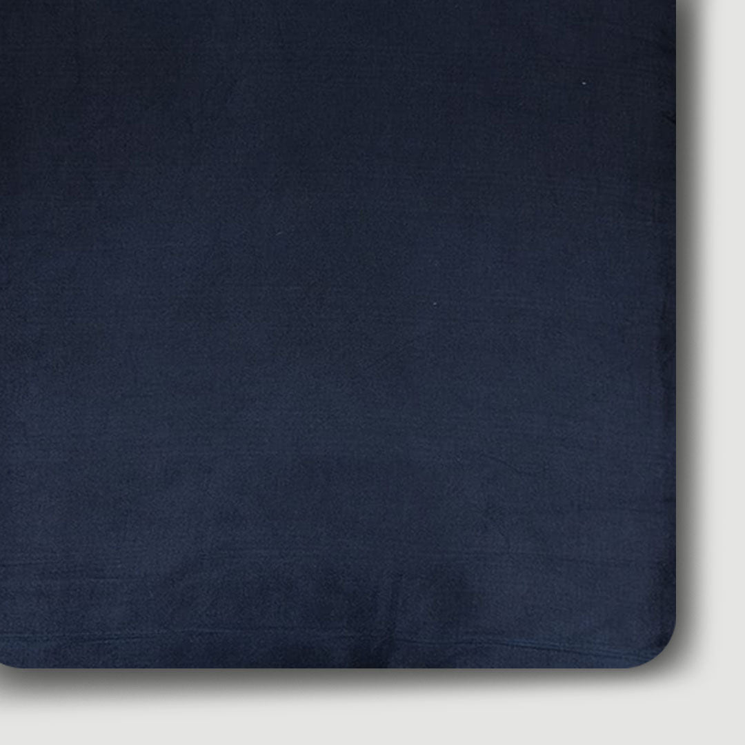 Luxurious navy blue plain Mashru silk fabric, ideal for creating elegant and refined garments with a smooth texture.