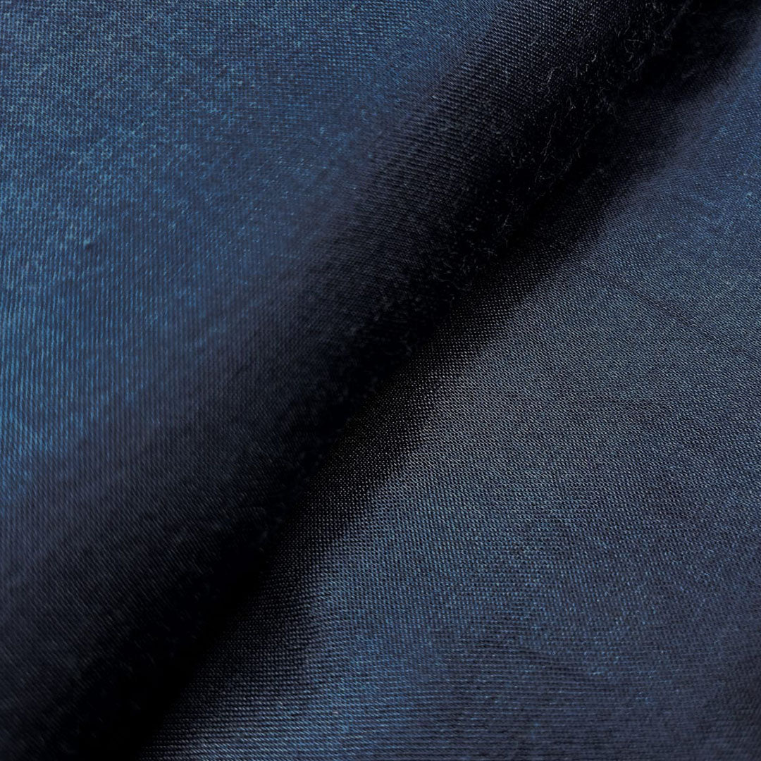 Luxurious navy blue plain Mashru silk fabric, ideal for creating elegant and refined garments with a smooth texture.