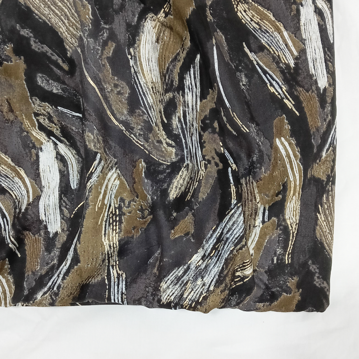 Modern dark grey rayon fabric with bold black abstract print and gold accents