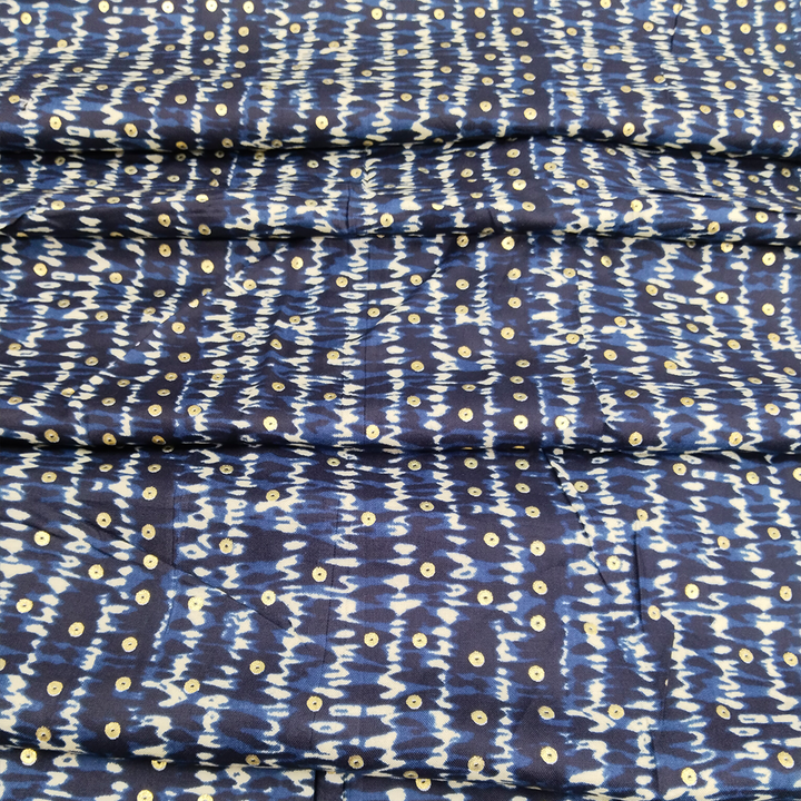 Soft and stylish blue polka dot print on rayon fabric